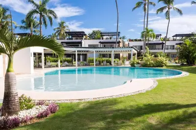 a large swimming pool in front of a building at Oasis Apartment C4 inside ALIGIO Residence Hotel in Las Terrenas