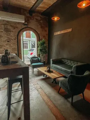 a living room with a couch and chairs and a table at Mosquito Boutique Hotel Zona Colonial in Santo Domingo