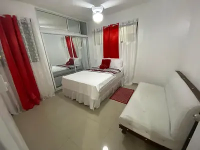 a small room with a bed and a mirror at 6A Cozy Apt in Santiago Center - Great Stay in Santiago de los Caballeros