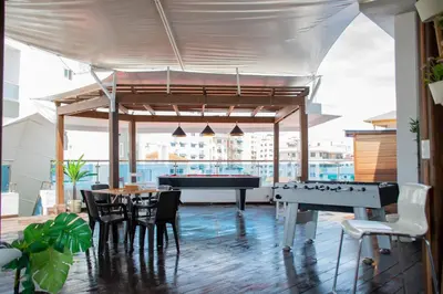a room with a pool table and a table and chairs at Santo Domingo Luxury Apartment with 8 Bedrooms in Santo Domingo