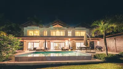 a large house with a swimming pool at night at Luxurious Villa at Puerto Bahia with Great Views in Los Grini