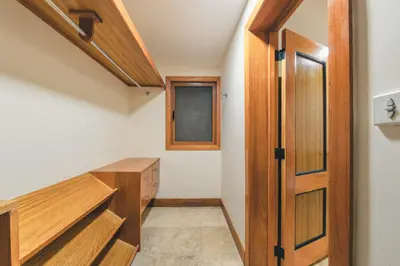 a hallway with a wooden door in a house at Luxurious Villa at Puerto Bahia with Great Views in Los Grini