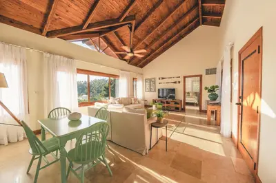 a living room with a table and a couch at Luxurious Villa at Puerto Bahia with Great Views in Los Grini