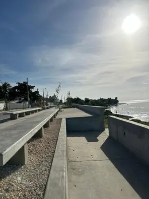 a row of benches next to the beach at Hotel Sol Azul in La Romana