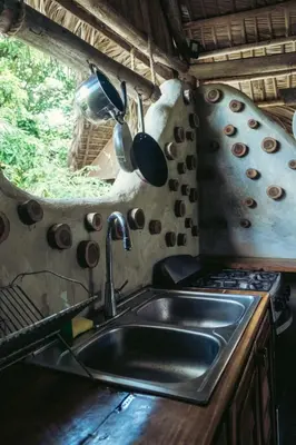 a kitchen with a sink and a stove at Bungalows India, El Valle, Samana in Santa Bárbara de Samaná
