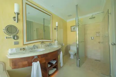 a bathroom with a sink and a shower and a toilet at JOIA Bavaro by Iberostar - Adults Only All Inclusive Resort in Punta Cana