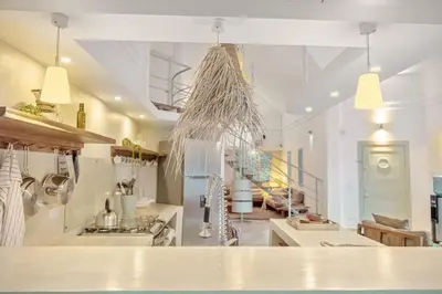 a kitchen with white counters and a ceiling at Tropical Penthouse in the Heart of Las Terrenas! in Las Terrenas