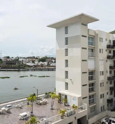 a building with a view of the water at Estancia Casa Real Frente a la Zona Colonial in Calero