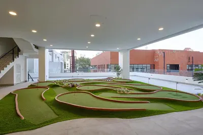 a large building with a maze of tracks in the floor at Monaco Residences Piantini in Santo Domingo
