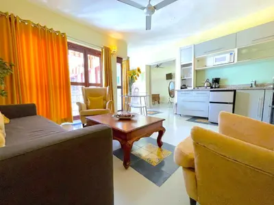 a living room with a couch and a table at Hotel Boutique Casa Sánchez in Santo Domingo