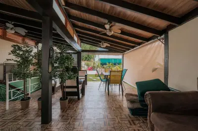 a living room with a couch and a table at Hotel Boutique Casa Sánchez in Santo Domingo
