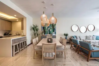 a kitchen and living room with a table and chairs at 3BR apartment with balcony in Portillo - Terrenas in Abra Grande