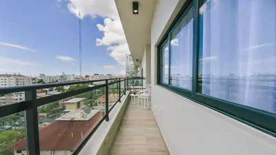 a balcony with a view of the city at Fully Serviced Apartment at Regatta Living II - 907 in Santo Domingo
