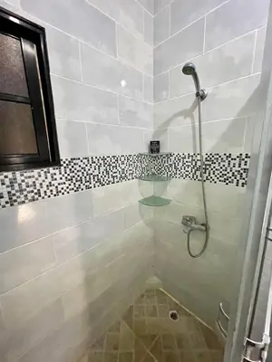 a bathroom with a shower with a glass floor at Oasis de paz 2 in Jarabacoa