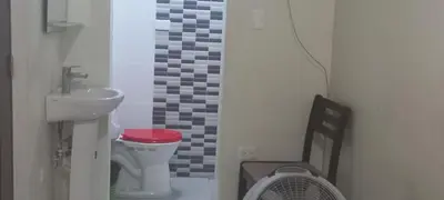 a small bathroom with a sink and a toilet at Cozy Guest Room in Santo Domingo Este with Private Entrance in La Viva