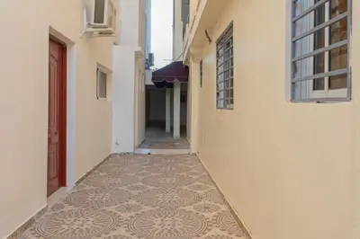 an alley with a tiled floor in a building at 1-Bedroom Apartment Retreat in Santo Domingo Este in La Viva
