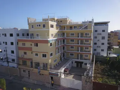 a tall building with a balcony in front of it at 1-Bedroom Apartment Retreat in Santo Domingo Este in La Viva