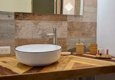 a large white tub sitting on a wooden counter in a bathroom at Chaykovski Boutique H in Las Terrenas