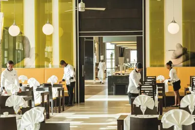 a group of chefs working in a restaurant at Riu Republica - Adults Only - All Inclusive in Punta Cana