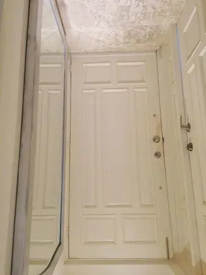 a white door in a room with a mirror at Private room in the Boca Chica Resort condominium in Boca Chica