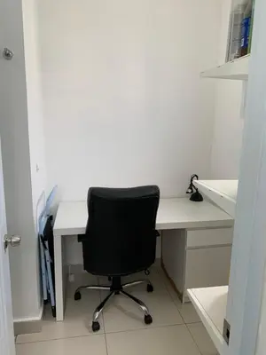 a white desk with a black chair in a room at Furnished Apartment - Residencial Olas - Gated Community - 24 hr Security in San Felipe de Puerto Plata