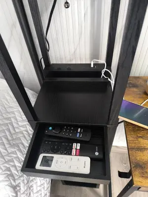 a room with a bed with a control box at La casita de Gazcue in Santo Domingo