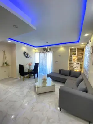 a living room with a couch and a table at Cozy Apartment RM in Santiago de los Caballeros