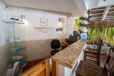 an office with a counter and a water room sign on the wall at Bungalow #15 at Waterfront Playa Alicia in Sosúa
