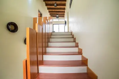 a staircase in a building with wooden railings at Villa segur-a vicente in Concepción de La Vega