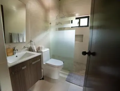 a bathroom with a toilet and a sink at Villa segur-a vicente in Concepción de La Vega