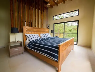 a bedroom with a bed and a large window at Villa segur-a vicente in Concepción de La Vega