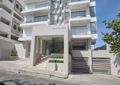 a building with the entrance to a building at Apartments in La Julia 1 and 2 Bedrooms in Santo Domingo
