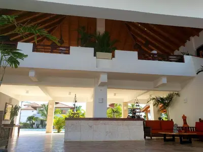a lobby of a building with a staircase in it at Residencial Paraiso Bayahibe in Bayahibe