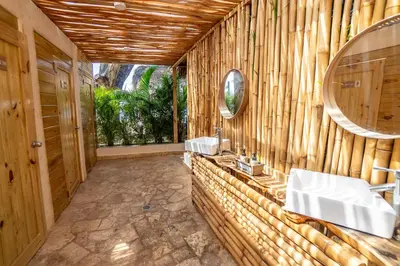 a bathroom with two sinks and a mirror at Room #23 at Waterfront Playa Alicia in Sosúa