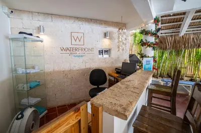 an office with a counter and a water room sign on the wall at Bungalow #6 at Waterfront Playa Alicia in Sosúa