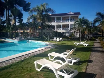 a villa with a swimming pool and a resort at Playa Turquesa only 50m From the Beach Walk to all Restaurants in Las Terrenas