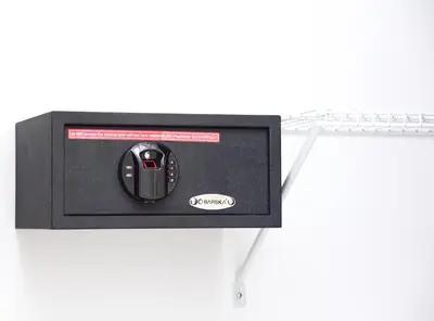 a black mouse in a black box on a shelf at S1401 La mejor vista Downtown Santo Domingo RD in Santo Domingo