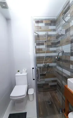 a bathroom with a toilet and a shower at S1401 La mejor vista Downtown Santo Domingo RD in Santo Domingo