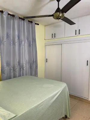 a bedroom with a bed and a ceiling fan at TriRoom Apartment SANTO DOMINGO ESTE in Santo Domingo
