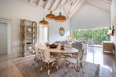 a dining room with a table and chairs at Newly Added El Portillo 2BR Apt in Abra Grande