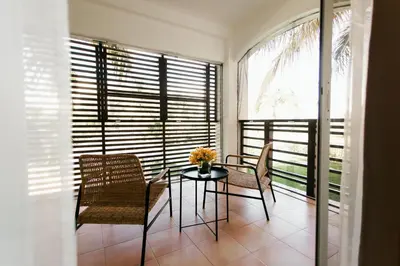 a dining room with a table and chairs and a window at Punta Cana 2 Bedr. up to 6 guests 1 mile to Beach in Punta Cana