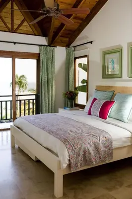 a bedroom with a large bed and a balcony at Ocean View Villa/Luxury Puerto Bahia Resort/Samaná in Santa Bárbara de Samaná