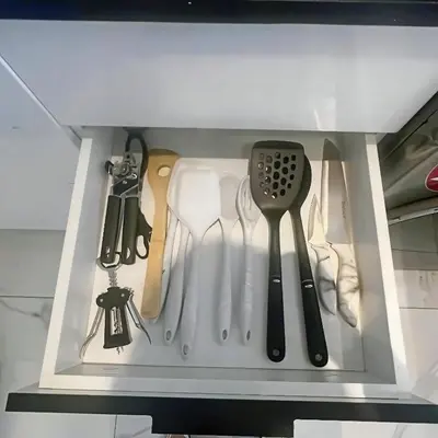 a drawer filled with cooking utensils and a spatula at Cana Rock Star Pool View Whith BBQ in Punta Cana