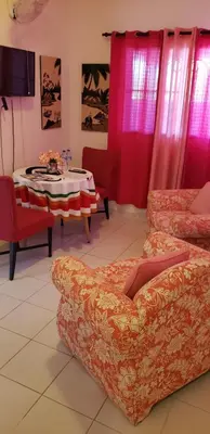 a living room with a couch and a table at Lovely location , right downtown Puerto Plata in San Felipe de Puerto Plata