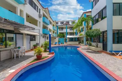 a swimming pool in the middle of a building at Apartamentos in Condo Plaza Europa in Sosúa