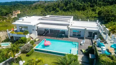an aerial view of a house with a swimming pool at Villas Agua Dulce in Sosúa