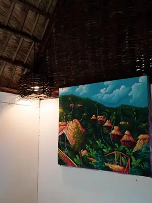 a painting hanging on a wall in a room at Valle Bucana in Santa Bárbara de Samaná