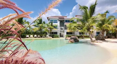 a house on the beach with a swimming pool at Casa en Paraiso RD in Bayahibe