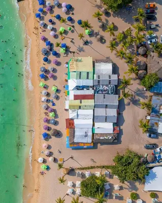 an aerial view of a beach with umbrellas and the ocean at Casa en Paraiso RD in Bayahibe