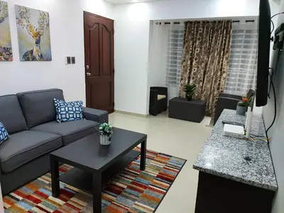 a living room with a couch and a coffee table at 4to nivel 2 habitaciones 2 baños Alma Rosa I in El Seis